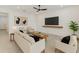 Bright living room with modern furniture, decor and neutral color palette at 1773 Groveline Rd, St Cloud, FL 34771