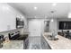Well-equipped kitchen with stainless steel appliances, granite countertops, and generous lighting at 1857 E Cooper Dr, Deltona, FL 32725