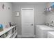 Well-organized laundry room with shelving, washer, and dryer offering convenience at 1857 E Cooper Dr, Deltona, FL 32725