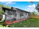 Backyard of home featuring artificial turf, new fence, and updated exterior at 205 W Princeton St, Orlando, FL 32804