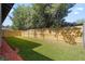 Fenced backyard with new wooden fencing, wood mulch, and artificial grass at 205 W Princeton St, Orlando, FL 32804