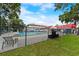Fenced community pool with lounge seating, providing a relaxing recreational space for residents at 205 W Princeton St, Orlando, FL 32804