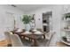 Cozy dining area with a table for six, decorative vase, and view into the kitchen at 205 W Princeton St, Orlando, FL 32804