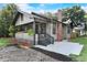 Charming home featuring a cozy front porch, brick chimney, and tasteful landscaping at 205 W Princeton St, Orlando, FL 32804