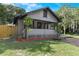 Charming home with a cozy front porch, landscaped yard, and classic architectural details at 205 W Princeton St, Orlando, FL 32804
