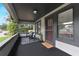 Inviting covered front porch with seating area, offering a relaxing outdoor space at 205 W Princeton St, Orlando, FL 32804