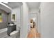 Bright hallway with hardwood floors leading to bathroom and bedroom at 205 W Princeton St, Orlando, FL 32804