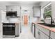 Well-appointed kitchen features stainless steel appliances and butcher block countertops at 205 W Princeton St, Orlando, FL 32804