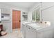 Bright laundry room featuring ample sunlight, new machines, and marble tile floors at 205 W Princeton St, Orlando, FL 32804