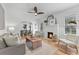 Cozy living room with hardwood floors, a fireplace, and an archway leading to the dining area at 205 W Princeton St, Orlando, FL 32804