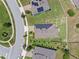 Aerial view of home showcasing solar panels on the roof in a residential neighborhood at 209 Luxmore Rd, Groveland, FL 34736