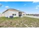Backyard featuring a well-maintained lawn and patio, perfect for outdoor entertaining and recreation at 209 Luxmore Rd, Groveland, FL 34736