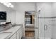 Bright bathroom with double sinks, large mirror, and glass enclosed walk-in shower at 209 Luxmore Rd, Groveland, FL 34736