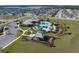 Aerial view showcasing community amenities with sparkling pool, recreation center and playground, perfect for Gathering activities at 2095 Heart Lake Dr, Groveland, FL 34736