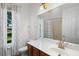 Bright bathroom with a garden view, neutral tile and updated fixtures at 215 Juniper Ridge Ct, Sanford, FL 32771