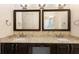 Bathroom featuring double sink vanity with granite countertops, dark wood cabinets, and stylish fixtures at 215 Juniper Ridge Ct, Sanford, FL 32771