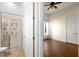 Bathroom and Bedroom connected, featuring a tiled shower and hardwood floors at 215 Juniper Ridge Ct, Sanford, FL 32771