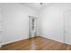Bright, empty bedroom with hardwood floors and a view of the backyard at 215 Juniper Ridge Ct, Sanford, FL 32771