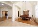 Bright formal dining room featuring high ceilings, hardwood floors and stylish chandelier at 215 Juniper Ridge Ct, Sanford, FL 32771