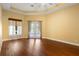 Large bedroom featuring tray ceiling and french doors leading to the exterior at 215 Juniper Ridge Ct, Sanford, FL 32771