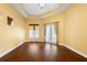Bright and airy room with hardwood floors, a tray ceiling, and lots of natural light at 215 Juniper Ridge Ct, Sanford, FL 32771