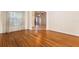 Expansive room with hardwood flooring, soft natural light, and easy access to other rooms at 215 Juniper Ridge Ct, Sanford, FL 32771