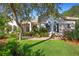 Inviting home exterior with mature trees and well-maintained landscaping at 215 Juniper Ridge Ct, Sanford, FL 32771
