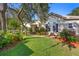 Charming home with a lush green lawn and beautiful landscaping at 215 Juniper Ridge Ct, Sanford, FL 32771