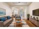 Inviting living room with hardwood floors, neutral decor, and an open layout at 215 Juniper Ridge Ct, Sanford, FL 32771