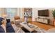 Cozy living room with stylish decor, hardwood floors, and an open layout at 215 Juniper Ridge Ct, Sanford, FL 32771