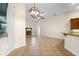 Bright living space with a fireplace, decorative light fixture, and tile flooring at 215 Juniper Ridge Ct, Sanford, FL 32771