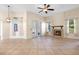 Open living area featuring a fireplace, tile flooring, and access to the backyard at 215 Juniper Ridge Ct, Sanford, FL 32771