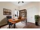 Office with hardwood floors, built-in shelving, ceiling fan, and desk at 215 Juniper Ridge Ct, Sanford, FL 32771