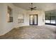 Spacious outdoor patio featuring brick flooring, ceiling fan, and double doors to the home's interior at 215 Juniper Ridge Ct, Sanford, FL 32771