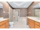 Bathroom featuring dual sinks, tile shower, and bathtub at 2153 Cypress Villas Dr, Orlando, FL 32825