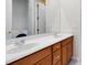 Bathroom featuring double sinks with wood cabinets, tiled floors and a laundry room at 2153 Cypress Villas Dr, Orlando, FL 32825