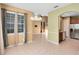 Open dining area with large windows, tile flooring, and easy access to the kitchen at 2153 Cypress Villas Dr, Orlando, FL 32825