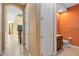 Hallway showing a half bathroom and stairs leading to the second level at 2153 Cypress Villas Dr, Orlando, FL 32825
