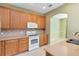 Bright kitchen featuring wooden cabinets, modern appliances, and an open design at 2153 Cypress Villas Dr, Orlando, FL 32825