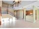 Spacious living room featuring high ceilings, a staircase, and open access to the kitchen at 2153 Cypress Villas Dr, Orlando, FL 32825