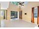 Open living room with tile flooring, neutral paint, and large windows for ample natural light at 2153 Cypress Villas Dr, Orlando, FL 32825
