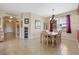 Open dining room with decorative chandelier and access to other living areas at 23820 Sardinia Dr, Sorrento, FL 32776