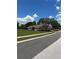 Well-maintained single-story home with a large front yard and mature trees at 23820 Sardinia Dr, Sorrento, FL 32776