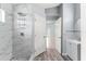 Sleek bathroom featuring a marbled walk-in shower and stylish vanity with a silver faucet at 2511 Brookstone Dr, Kissimmee, FL 34744