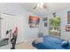 This bedroom features neutral colors and a large window for natural light at 2511 Brookstone Dr, Kissimmee, FL 34744