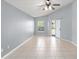 Bedroom with tile floors, light-gray walls, and a glass sliding door to the backyard at 2511 Brookstone Dr, Kissimmee, FL 34744