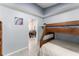 Comfortable bedroom with a bunk bed and a view into the dining room at 2511 Brookstone Dr, Kissimmee, FL 34744