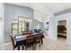 Dining area with modern light fixture, views of back yard and connections to living area at 2511 Brookstone Dr, Kissimmee, FL 34744