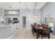 Open concept: dining area connecting kitchen, breakfast bar and living area at 2511 Brookstone Dr, Kissimmee, FL 34744