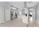 Open kitchen with stainless appliances, white cabinetry, and tiled floors at 2511 Brookstone Dr, Kissimmee, FL 34744